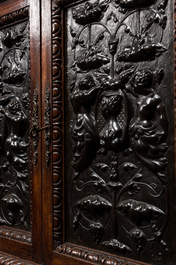 A carved oak buffet with stamped copper panels, 19/20th C.