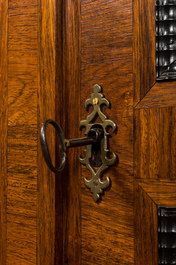 A Flemish wooden two-door cupboard with tortoiseshell and ebonised accents, 17th C. and later