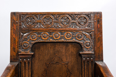 An inlaid carved oak chair with a Star of David, 17th C.