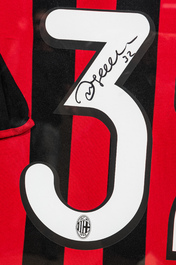 A framed and A.C. Milan football jersey signed by David Beckham