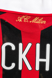 A framed and A.C. Milan football jersey signed by David Beckham