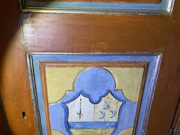 A pair of large Italian polychrome wooden two-door cupboards with coats of arms, 17th C.