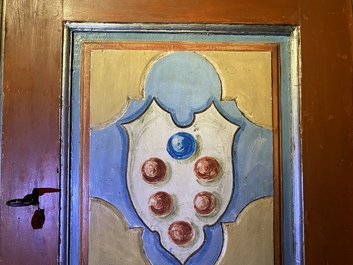 A pair of large Italian polychrome wooden two-door cupboards with coats of arms, 17th C.