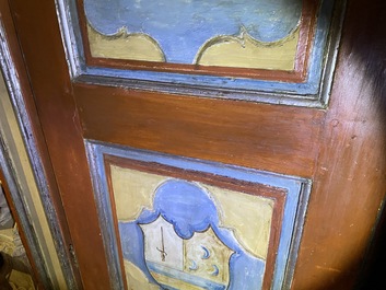 A pair of large Italian polychrome wooden two-door cupboards with coats of arms, 17th C.