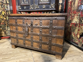 A wrought iron-mounted wooden coffer, 17th C.