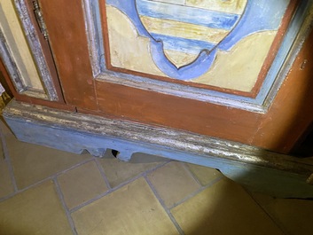 A pair of large Italian polychrome wooden two-door cupboards with coats of arms, 17th C.