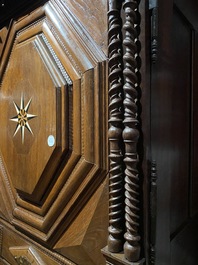 An imposing baroque-style parquetry oak four-door cupboard, 19th C.