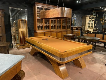 A burl wood veneered billiard table with accompanying lighting and cue holder, 20th C.