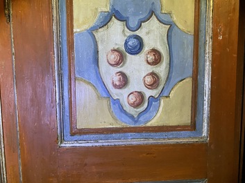 A pair of large Italian polychrome wooden two-door cupboards with coats of arms, 17th C.