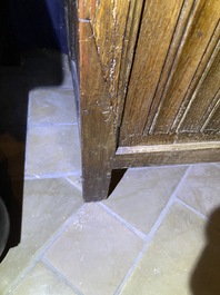 A Flemish oak three-door cupboard with carved panels, 16th C.