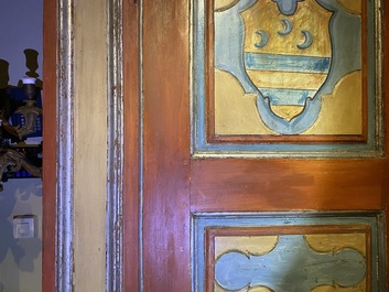 A pair of large Italian polychrome wooden two-door cupboards with coats of arms, 17th C.