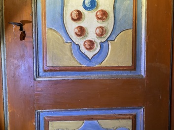 A pair of large Italian polychrome wooden two-door cupboards with coats of arms, 17th C.