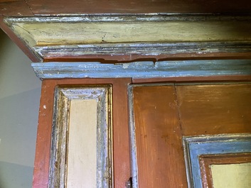 A pair of large Italian polychrome wooden two-door cupboards with coats of arms, 17th C.