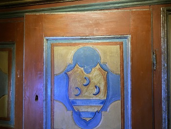 A pair of large Italian polychrome wooden two-door cupboards with coats of arms, 17th C.