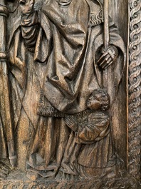 A carved oak panel depicting Saint James with a bishop, The Low Countries, late 15th C.