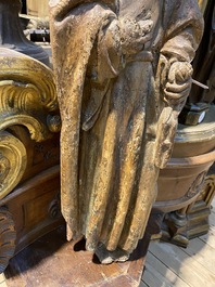 A Flemish oak figure of Saint John with traces of polychromy, 16th C.