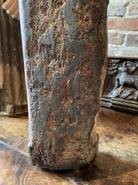 A Flemish carved and polychromed oak figure of a bishop on an armorial base, ca. 1500