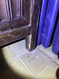 A Flemish oak three-door cupboard with carved panels, 16th C.