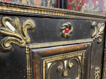 An ebonised and inlaid wooden cabinet, 19th C.