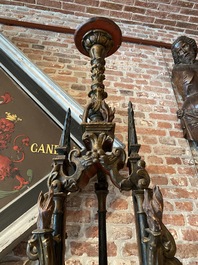 A pair of large polychromed and gilt processional torches with cherub heads, 18th C.