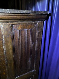 A Flemish oak three-door cupboard with carved panels, 16th C.