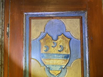 A pair of large Italian polychrome wooden two-door cupboards with coats of arms, 17th C.