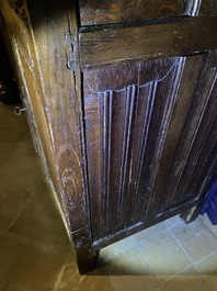 A Flemish oak three-door cupboard with carved panels, 16th C.