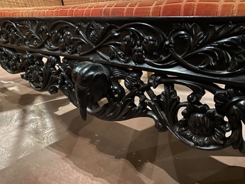 An Anglo-Indian colonial carved wooden sofa with two matching chairs, late 19th C.