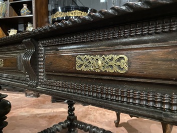 A partly ebonised walnut table on barley-twist base with baluster legs, 19th C.