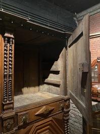 An imposing baroque-style parquetry oak four-door cupboard, 19th C.