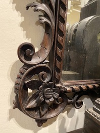 An ebonised walnut rococo-style mirror, probably Italy, 18/19th C.