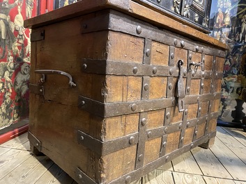 A wrought iron-mounted wooden coffer, 17th C.