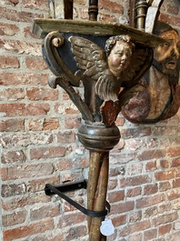 A pair of large polychromed and gilt processional torches with cherub heads, 18th C.