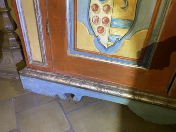 A pair of large Italian polychrome wooden two-door cupboards with coats of arms, 17th C.