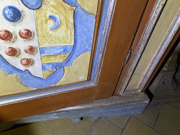 A pair of large Italian polychrome wooden two-door cupboards with coats of arms, 17th C.