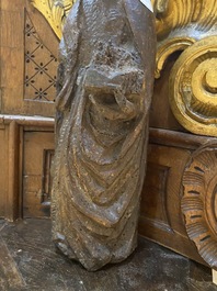 A Spanish walnut figure of John the Baptist, mid 15th C.