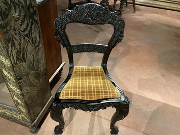 An Anglo-Indian colonial carved wooden sofa with two matching chairs, late 19th C.