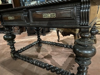 A partly ebonised walnut table on barley-twist base with baluster legs, 19th C.