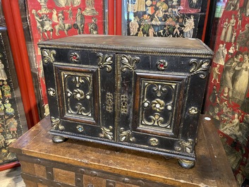 An ebonised and inlaid wooden cabinet, 19th C.