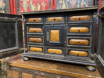 An ebonised and inlaid wooden cabinet, 19th C.