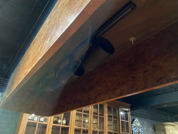 A burl wood veneered billiard table with accompanying lighting and cue holder, 20th C.