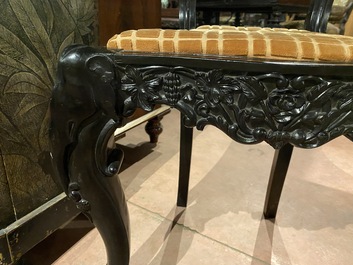 An Anglo-Indian colonial carved wooden sofa with two matching chairs, late 19th C.