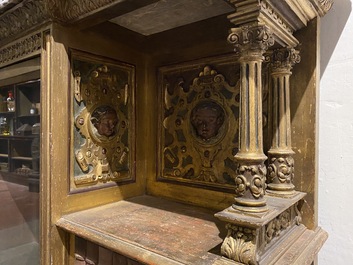 A polychrome and partly gilt wooden Renaissance Revival cabinet with trompe l'oeil doors, Italy, 19th C.