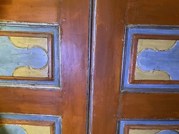 A pair of large Italian polychrome wooden two-door cupboards with coats of arms, 17th C.