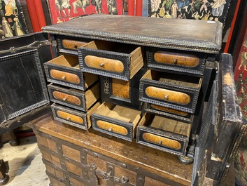 An ebonised and inlaid wooden cabinet, 19th C.