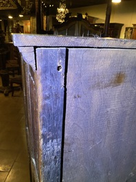 A Flemish oak three-door cupboard with carved panels, 16th C.