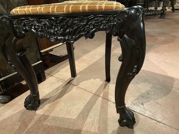 An Anglo-Indian colonial carved wooden sofa with two matching chairs, late 19th C.