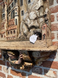 Grand relief de J&eacute;rusalem en bois sculpt&eacute; et polychrom&eacute; sur une console au putto ail&eacute;, 19&egrave;me