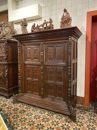 A rare German carved oak sculptural cupboard on diagonal supports with recumbent lions, Westphalia, 16th C.