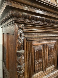 A rare German carved oak sculptural cupboard on diagonal supports with recumbent lions, Westphalia, 16th C.